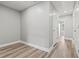 Minimalist hallway showing light gray walls, white trim, and light colored floors at 5341 Stewart Mill Rd, Douglasville, GA 30135