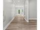 Bright hallway showcasing modern flooring and neutral paint, leading to various rooms at 5341 Stewart Mill Rd, Douglasville, GA 30135
