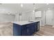 Spacious open-concept kitchen with a central island and modern appliances at 5341 Stewart Mill Rd, Douglasville, GA 30135
