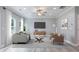 Cozy living room featuring modern furniture, a gray rug, and a large TV for relaxation and entertainment at 5341 Stewart Mill Rd, Douglasville, GA 30135