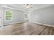 Spacious main bedroom with tray ceilings, natural light, and modern flooring creating a serene retreat at 5341 Stewart Mill Rd, Douglasville, GA 30135