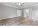 Large main bedroom with tray ceilings, natural light, and ensuite bathroom and walk-in closet access at 5341 Stewart Mill Rd, Douglasville, GA 30135