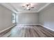 Bright and airy main bedroom featuring trey ceilings, natural light, and modern flooring at 5341 Stewart Mill Rd, Douglasville, GA 30135