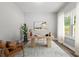 Well-lit home office with a modern desk, chair, and view from the window at 5341 Stewart Mill Rd, Douglasville, GA 30135