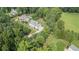 Aerial view showcasing a home on a sprawling lot with mature trees at 104 Trinity Hollow Dr, Canton, GA 30115