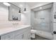 Modern bathroom with a sleek vanity, large mirror, glass shower, and stylish tile, perfect for a spa-like experience at 104 Trinity Hollow Dr, Canton, GA 30115
