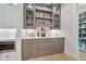 Butler's pantry area with custom cabinets and wine storage, perfect for entertaining at 104 Trinity Hollow Dr, Canton, GA 30115