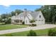 Attractive home featuring a 3-car garage, a welcoming front porch, and well-maintained landscaping at 104 Trinity Hollow Dr, Canton, GA 30115