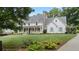 Beautiful home with a well-maintained lawn and charming architectural details at 104 Trinity Hollow Dr, Canton, GA 30115