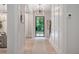Bright foyer with hardwood floors, decorative lighting, and an elegant door with glass panes at 104 Trinity Hollow Dr, Canton, GA 30115