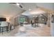 Expansive home office featuring exposed wooden beams, multiple workstations, and scenic outdoor views, promoting productivity at 104 Trinity Hollow Dr, Canton, GA 30115
