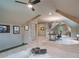Multi-functional office featuring a workstation, putting green and exposed beams, perfect for work and leisure activities at 104 Trinity Hollow Dr, Canton, GA 30115