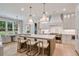 Modern kitchen featuring a large island with seating, stainless steel appliances, and ample cabinet space at 104 Trinity Hollow Dr, Canton, GA 30115