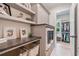 Well-organized laundry room with modern appliances, countertops, shelving, and easy access to walk-in closet at 104 Trinity Hollow Dr, Canton, GA 30115