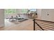 Bright and airy living room with large windows, offering ample natural light and space for relaxation at 104 Trinity Hollow Dr, Canton, GA 30115