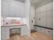 Custom mudroom with cabinets, drawers, bench, and desk space at 104 Trinity Hollow Dr, Canton, GA 30115