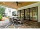 Inviting outdoor dining area on a stone patio, perfect for entertaining, with a view of the backyard at 104 Trinity Hollow Dr, Canton, GA 30115