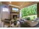 Outdoor fireplace and seating on the patio at 104 Trinity Hollow Dr, Canton, GA 30115