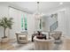 Comfortable sitting area with hardwood floors, an elegant chandelier, and views of the yard at 104 Trinity Hollow Dr, Canton, GA 30115