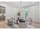 Cozy sitting area with stylish chairs, modern lighting, and a view of the outdoor space at 104 Trinity Hollow Dr, Canton, GA 30115