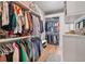 Spacious walk-in closet with custom shelving and clothing racks for optimal organization at 104 Trinity Hollow Dr, Canton, GA 30115