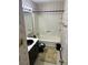 Bathroom featuring a vanity with a sink, wallpaper and a shower-tub combo with tile surround at 512 Rockborough Ter, Stone Mountain, GA 30083