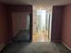 A view of a large bedroom with sliding mirror closet doors and a doorway at 512 Rockborough Ter, Stone Mountain, GA 30083