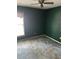 Bedroom with green walls, neutral carpet, a window with natural light and a ceiling fan at 512 Rockborough Ter, Stone Mountain, GA 30083