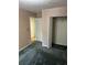 A simple bedroom showcasing an open closet and doorway to another room at 512 Rockborough Ter, Stone Mountain, GA 30083