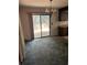 Dining area with sliding glass doors offering views of the backyard and a chandelier at 512 Rockborough Ter, Stone Mountain, GA 30083