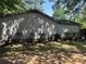Rear exterior with an array of shrubbery at the foot of the house at 512 Rockborough Ter, Stone Mountain, GA 30083