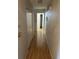 Hallway with wood floors leading to other rooms in the house at 512 Rockborough Ter, Stone Mountain, GA 30083