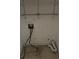 A small laundry room area with connections and open shelving at 512 Rockborough Ter, Stone Mountain, GA 30083