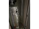 Water heater, wrapped in insulation, tucked in utility closet at 512 Rockborough Ter, Stone Mountain, GA 30083