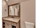 Bathroom vanity with granite countertop, modern fixtures, and ample storage at 829 Big Horn Holw, Suwanee, GA 30024