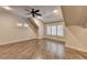 Bonus room featuring hardwood floors and natural light from the multiple windows at 829 Big Horn Holw, Suwanee, GA 30024