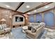 A large living space featuring wood trim, stonework, and comfortable seating at 829 Big Horn Holw, Suwanee, GA 30024