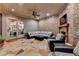 Covered patio with flagstone flooring featuring a brick fireplace and comfortable seating at 829 Big Horn Holw, Suwanee, GA 30024