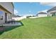 Spacious backyard featuring a well-manicured lawn and fence at 1363 Midnight Ride Ct, Hampton, GA 30228