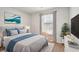 Bright bedroom featuring soothing blue accents and ample natural light at 1363 Midnight Ride Ct, Hampton, GA 30228