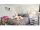Comfortable bedroom featuring unique furnishings and natural light at 1363 Midnight Ride Ct, Hampton, GA 30228