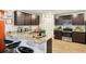 Well-equipped kitchen with granite countertops, stainless steel appliances, and breakfast bar at 1363 Midnight Ride Ct, Hampton, GA 30228