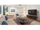 Cozy upstairs living area with comfortable seating, TV, and neutral decor at 1363 Midnight Ride Ct, Hampton, GA 30228