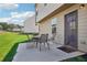Outdoor patio with seating area and view of the backyard at 1363 Midnight Ride Ct, Hampton, GA 30228
