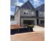 Newly constructed two-story townhome with a two-car garage and a brick facade at 3108 Marbella Cir # 4, Kennesaw, GA 30152