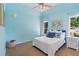 Well lit bedroom features light blue walls, neutral carpet and white nightstands at 3820 Ridge Point Dr, Suwanee, GA 30024