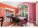 Bright dining room with a large arched window and colorful decor at 3820 Ridge Point Dr, Suwanee, GA 30024