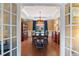 Elegant dining room with tray ceiling, hardwood floors, and ample natural light at 3820 Ridge Point Dr, Suwanee, GA 30024