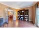 Inviting living room with hardwood floors, built-in bookshelves, and French doors at 3820 Ridge Point Dr, Suwanee, GA 30024