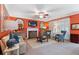 Warm living room with a fireplace, TV, and classic furnishings at 3820 Ridge Point Dr, Suwanee, GA 30024